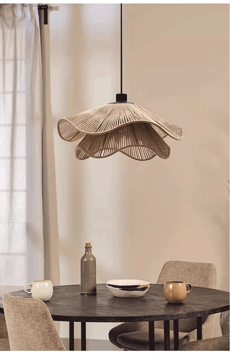 Modern dining room with a unique pendant light fixture.