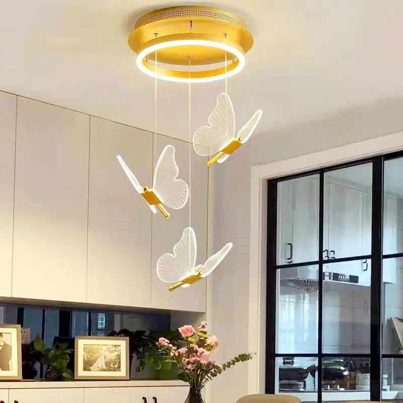 Modern ceiling light fixture with butterfly designs in a home setting