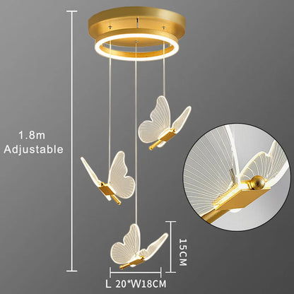 Gold butterfly pendant light with adjustable feature on a gray background